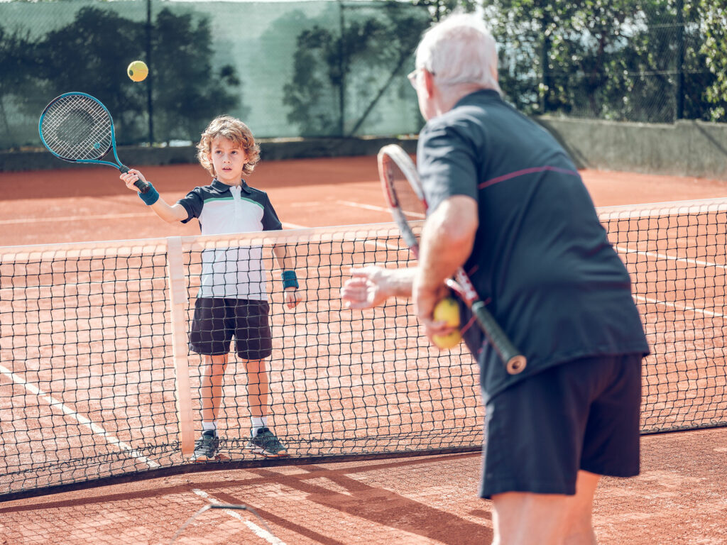 Ages tennis player teaching tennis